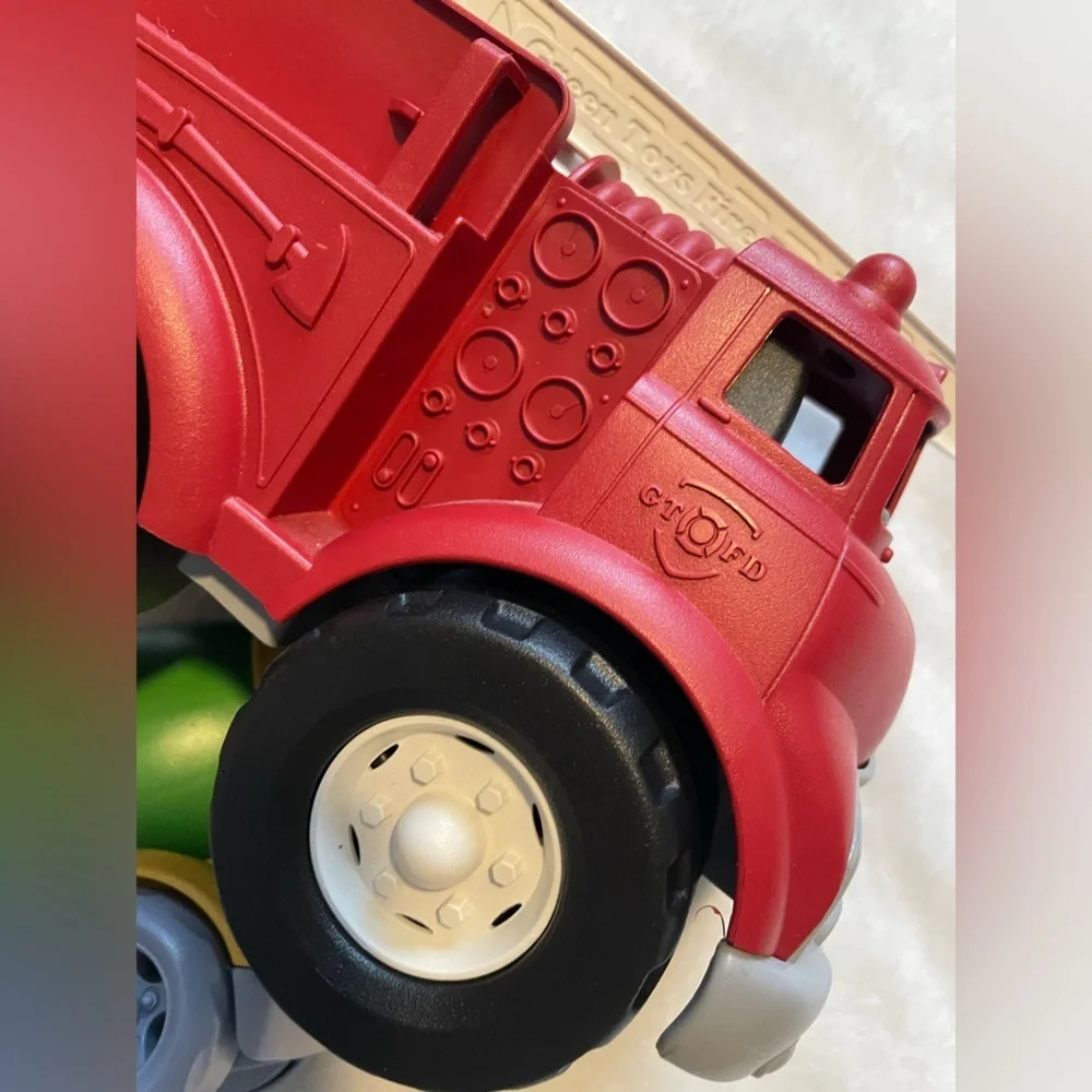 Bundle of Green Toys Firetruck, Car Loader, and Cement Truck